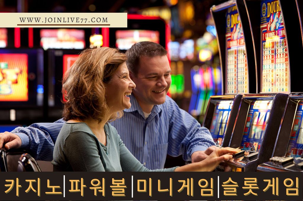 Happy couple playing slot machine in casino.